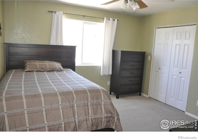 carpeted bedroom with a closet, a ceiling fan, and baseboards