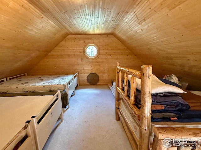 4911 Storm Mountain Dr, Drake, CO 80515 - bedroom featuring lofted ceiling, wooden walls, light colored carpet, and wooden ceiling
