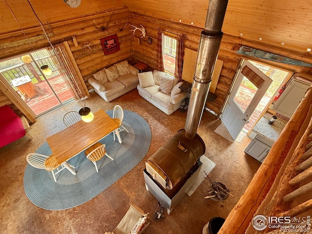 4911 Storm Mountain Dr, Drake, CO 80515 - carpeted living area with rustic walls and wooden ceiling