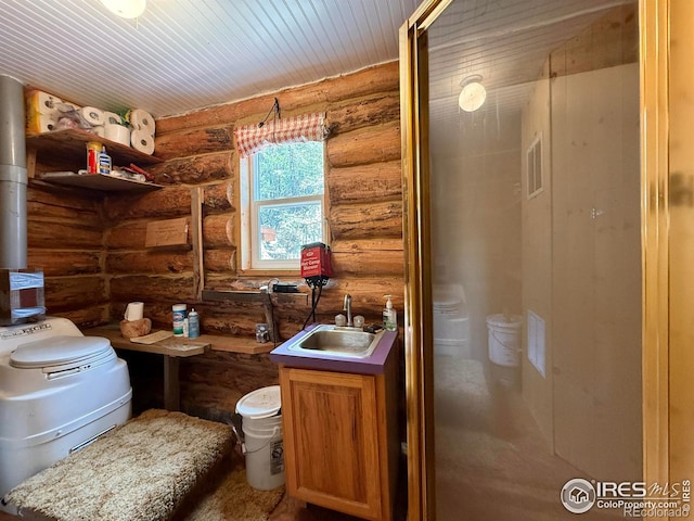 4911 Storm Mountain Dr, Drake, CO 80515 - bathroom featuring log walls, a sink, and wood ceiling
