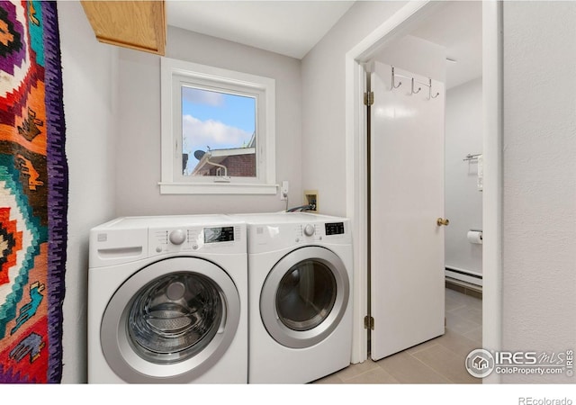 618 Whedbee St, Fort Collins, CO 80524 - washroom with washing machine and dryer, light tile patterned flooring, and a baseboard radiator