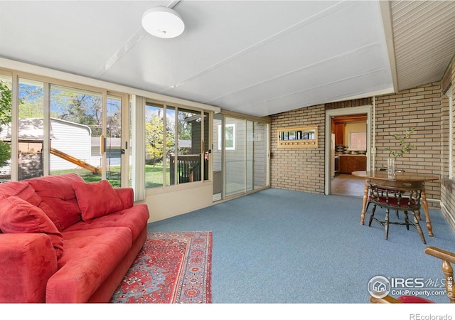 618 Whedbee St, Fort Collins, CO 80524 - sunroom / solarium featuring brick wall, plenty of natural light, and carpet flooring