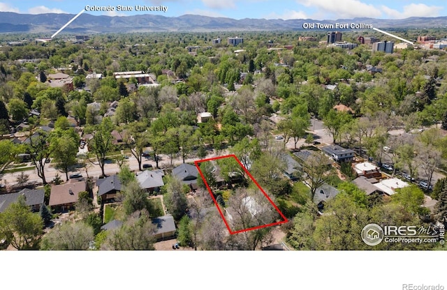618 Whedbee St, Fort Collins, CO 80524 - aerial overview of property's location with property parcel outlined and a mountainous background