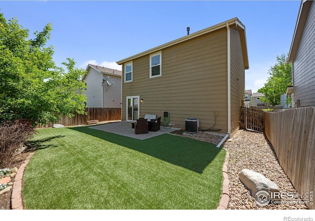 rear view of house featuring a patio and central AC unit