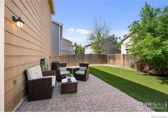 view of patio featuring an outdoor hangout area and cooling unit