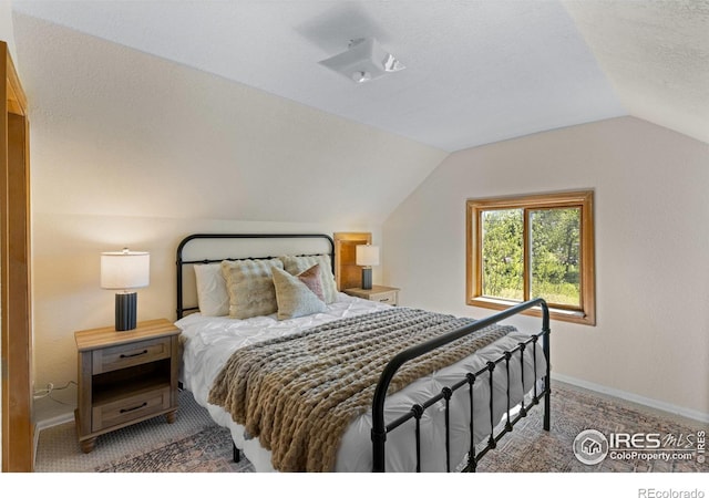 4743 Jay Rd, Boulder, CO 80301 - carpeted bedroom with lofted ceiling, baseboards, and a textured ceiling