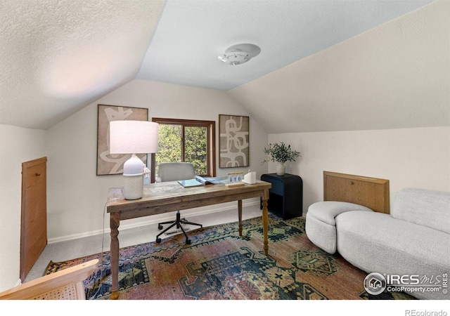 4743 Jay Rd, Boulder, CO 80301 - carpeted home office featuring lofted ceiling, a textured ceiling, and baseboards