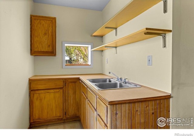 4743 Jay Rd, Boulder, CO 80301 - kitchen featuring a sink, open shelves, brown cabinetry, and light countertops