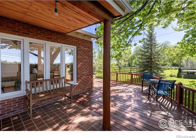 4743 Jay Rd, Boulder, CO 80301 - wooden terrace with outdoor dining area and a lawn