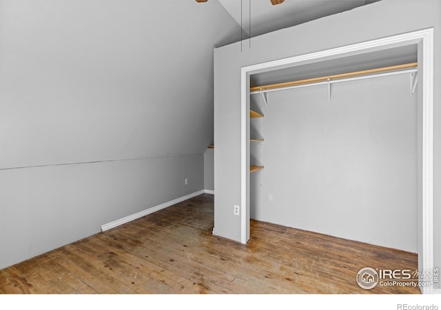 4743 Jay Rd, Boulder, CO 80301 - unfurnished bedroom with lofted ceiling, hardwood / wood-style floors, a closet, and ceiling fan