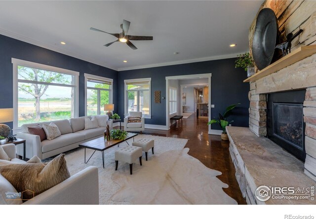 23111 County Road 1, Berthoud, CO 80513 - living room featuring ornamental molding, ceiling fan, a fireplace, baseboards, and recessed lighting