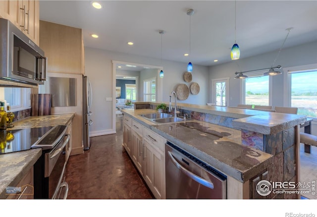 23111 County Road 1, Berthoud, CO 80513 - kitchen featuring appliances with stainless steel finishes, a sink, recessed lighting, finished concrete flooring, and a kitchen island with sink