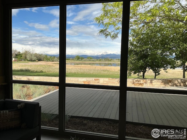 23111 County Road 1, Berthoud, CO 80513 - doorway to outside with a water and mountain view and healthy amount of natural light