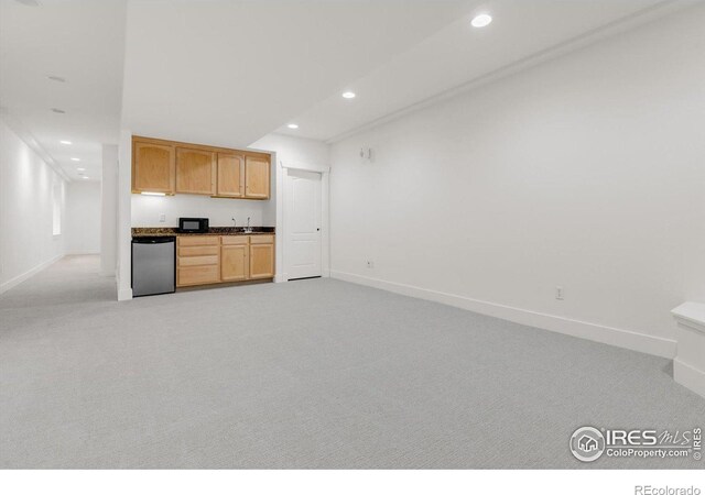 kitchen with dishwasher, recessed lighting, black microwave, baseboards, and light colored carpet