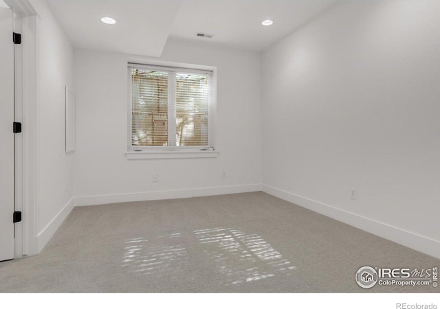 carpeted spare room with baseboards and recessed lighting
