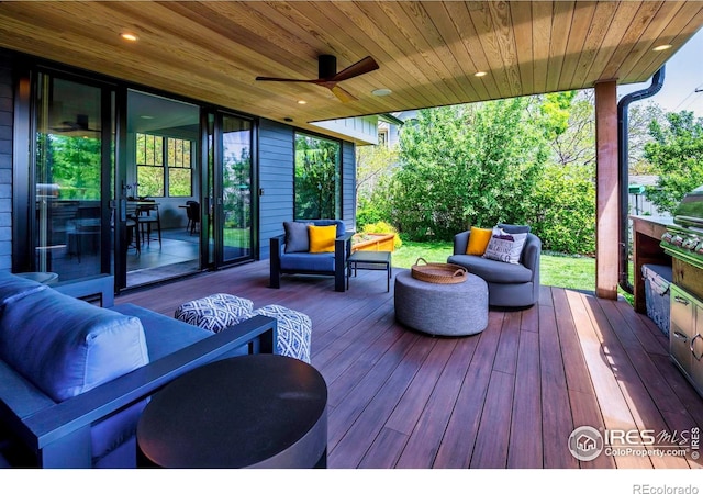 deck featuring an outdoor living space and a ceiling fan