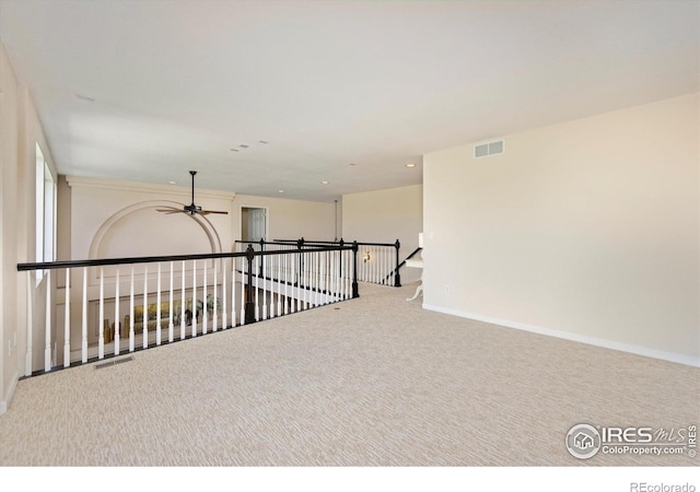 empty room with a ceiling fan, carpet flooring, baseboards, and recessed lighting