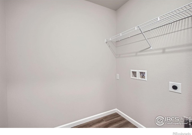 clothes washing area featuring hookup for a washing machine, dark wood finished floors, baseboards, and electric dryer hookup