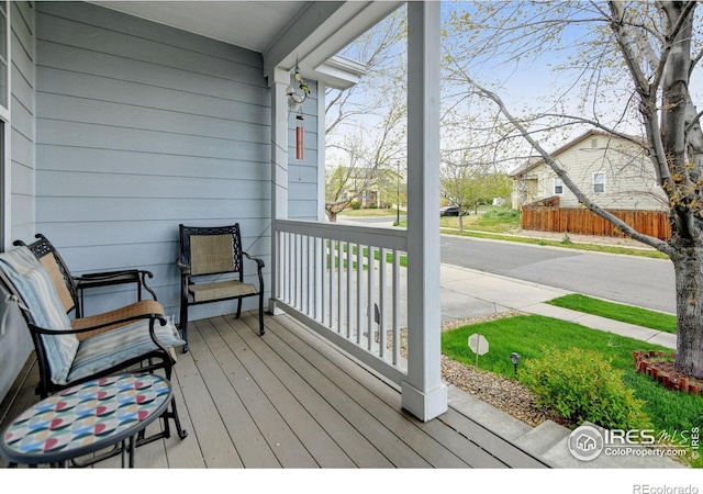 4312 Windmill Dr, Brighton, CO 80601 - deck featuring a porch