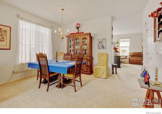 4312 Windmill Dr, Brighton, CO 80601 - carpeted dining space with a chandelier