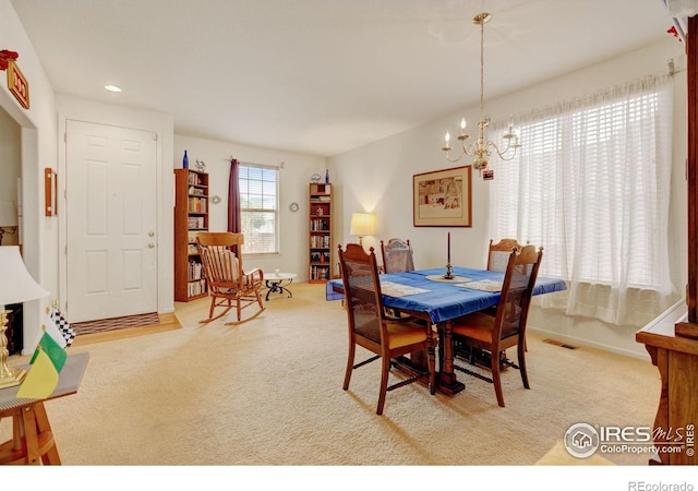 4312 Windmill Dr, Brighton, CO 80601 - dining area featuring carpet flooring, a chandelier, baseboards, and recessed lighting