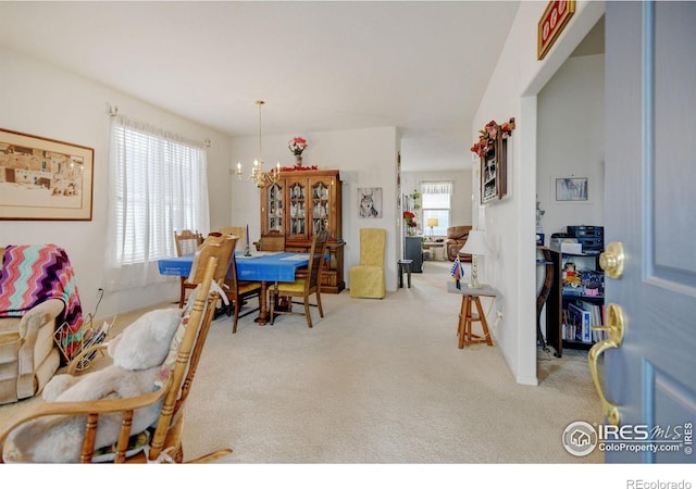 4312 Windmill Dr, Brighton, CO 80601 - dining space with a chandelier and carpet