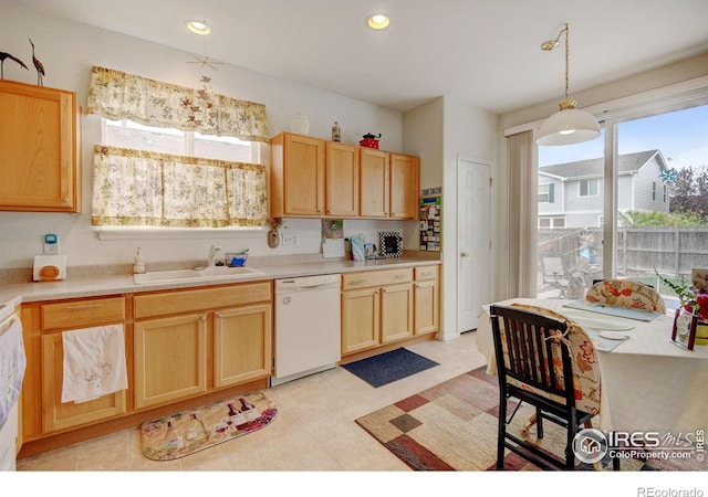 4312 Windmill Dr, Brighton, CO 80601 - kitchen featuring dishwasher, a sink, light brown cabinets, light countertops, and recessed lighting