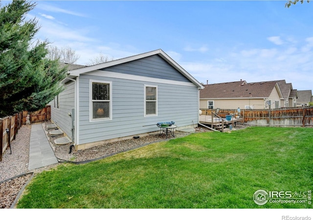 4312 Windmill Dr, Brighton, CO 80601 - rear view of house with a deck