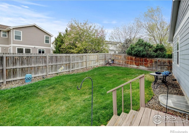 4312 Windmill Dr, Brighton, CO 80601 - view of yard featuring a wooden deck