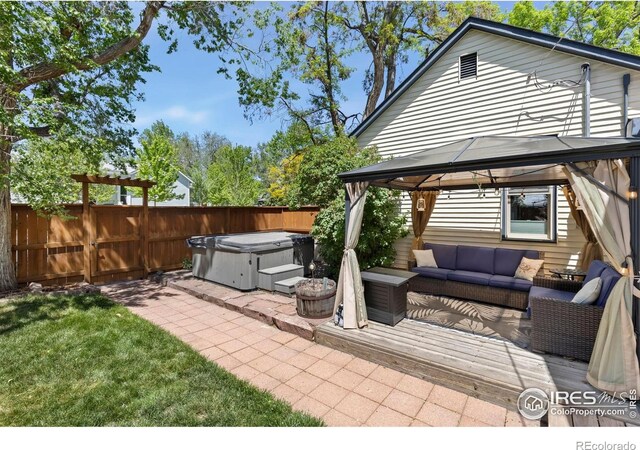 300 E Cleveland St, Lafayette, CO 80026 - view of patio featuring a gazebo, an outdoor hangout area, and a hot tub