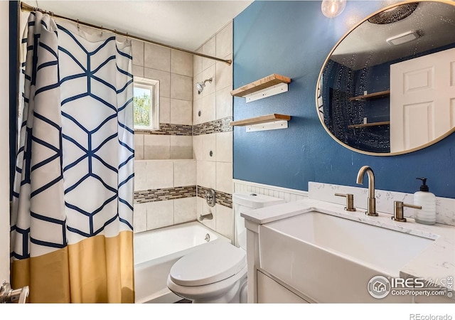 full bath with shower / bathtub combination with curtain, vanity, and toilet