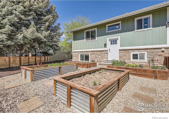 view of patio / terrace with a garden and fence
