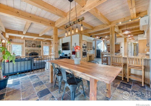 1057 Reed Ranch Rd, Boulder, CO 80302 - dining space with beam ceiling, a fireplace, stone tile floors, and wood ceiling