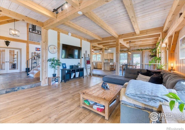 1057 Reed Ranch Rd, Boulder, CO 80302 - living room featuring french doors, stairway, wood finished floors, and wood ceiling