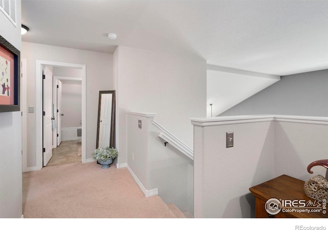 641 Yukon Ct, Windsor, CO 80550 - hall with an upstairs landing, carpet flooring, and baseboards