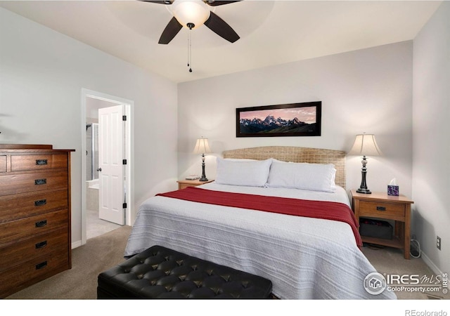 641 Yukon Ct, Windsor, CO 80550 - carpeted bedroom with baseboards, ensuite bath, and ceiling fan