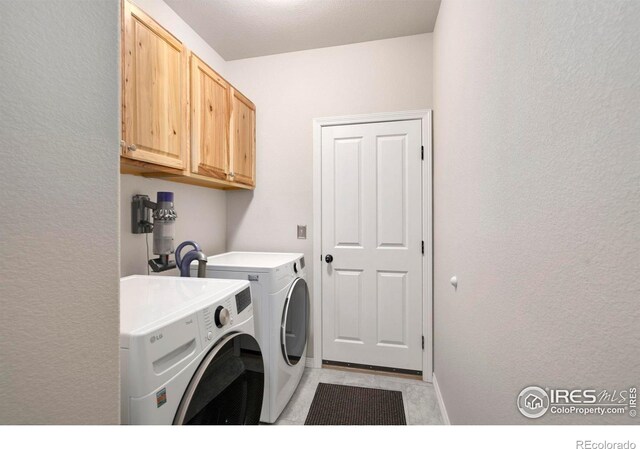 641 Yukon Ct, Windsor, CO 80550 - laundry room with independent washer and dryer, cabinet space, a textured wall, and baseboards