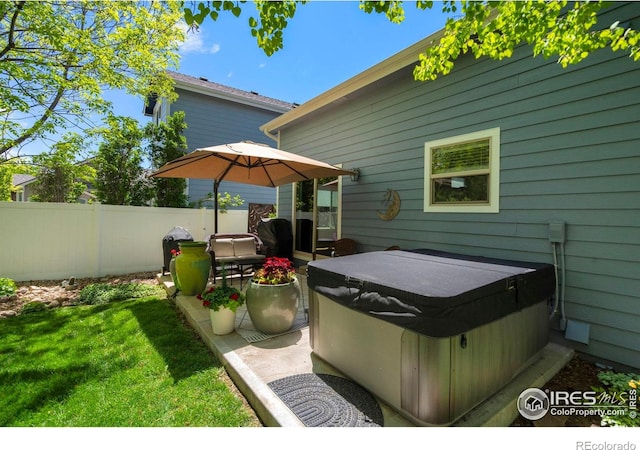 641 Yukon Ct, Windsor, CO 80550 - view of patio / terrace with a hot tub