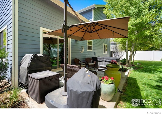 641 Yukon Ct, Windsor, CO 80550 - view of patio featuring a hot tub and a grill