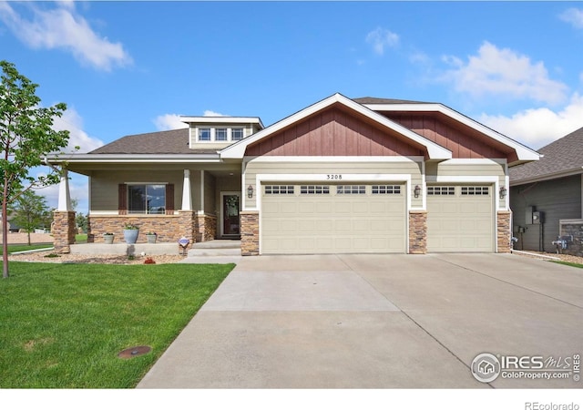 craftsman house with stone siding and an attached garage