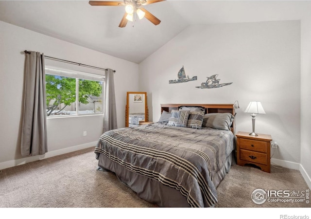 carpeted bedroom featuring lofted ceiling, baseboards, and a ceiling fan