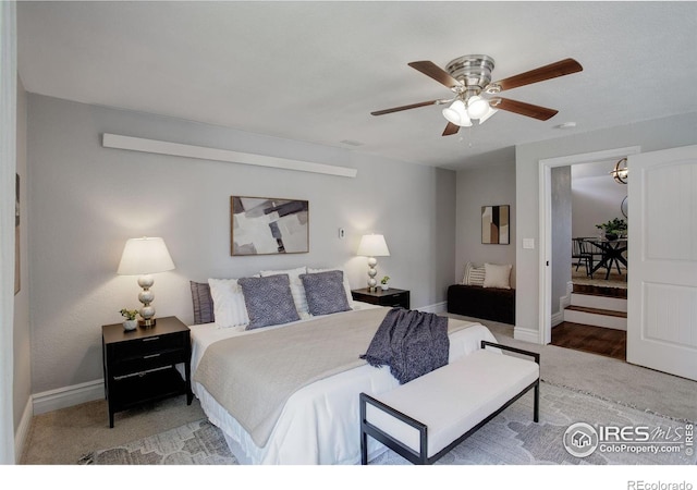 bedroom featuring carpet, baseboards, and ceiling fan