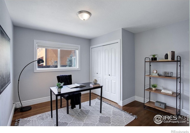 office with baseboards and wood finished floors