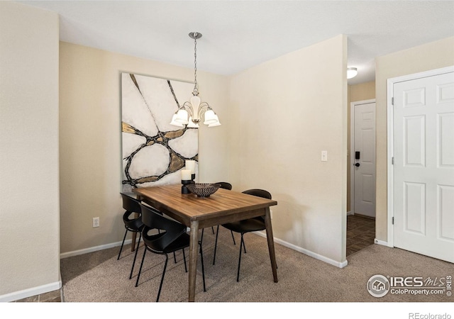 14300 Waterside Ln Unit V1, Broomfield, CO 80023 - dining room with a chandelier, carpet, and baseboards