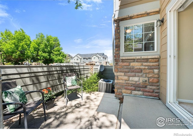 14300 Waterside Ln Unit V1, Broomfield, CO 80023 - view of patio / terrace featuring fence and central air condition unit