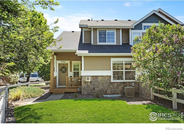 246 Rock Bridge Ln Unit 3, Windsor, CO 80550 - view of front of house with central AC, a porch, stone siding, and a shingled roof