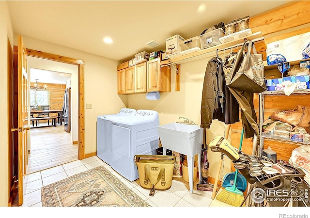 278 Clark Rd, Bailey, CO 80421 - washroom with washer and dryer, cabinet space, recessed lighting, and light tile patterned flooring