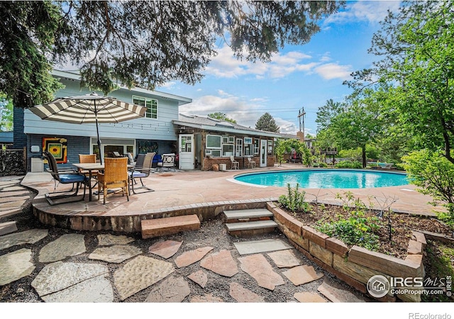 outdoor pool with a patio