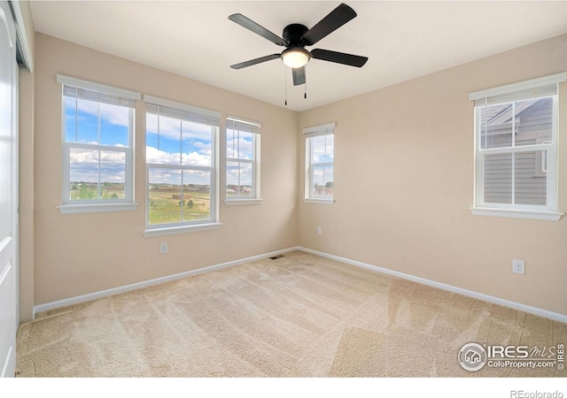 214 Tigercat Way, Fort Collins, CO 80524 - carpeted spare room featuring baseboards and a ceiling fan
