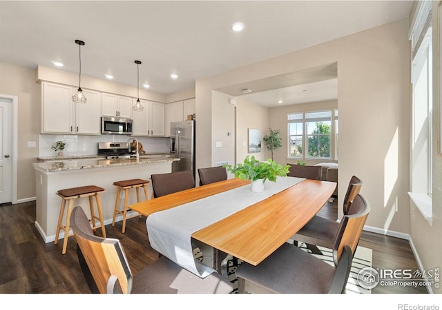 214 Tigercat Way, Fort Collins, CO 80524 - dining area featuring dark wood-type flooring, recessed lighting, and baseboards